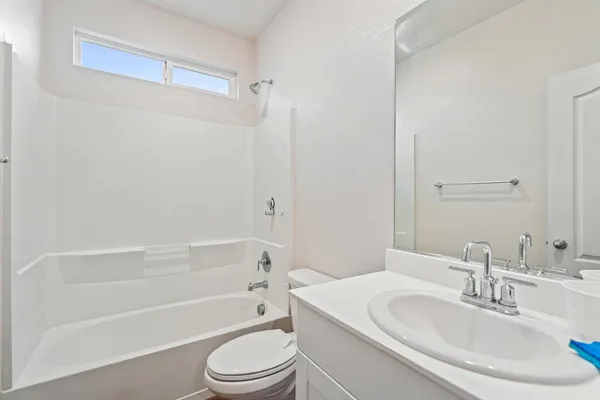 a bathroom with a toilet a sink and a bathtub