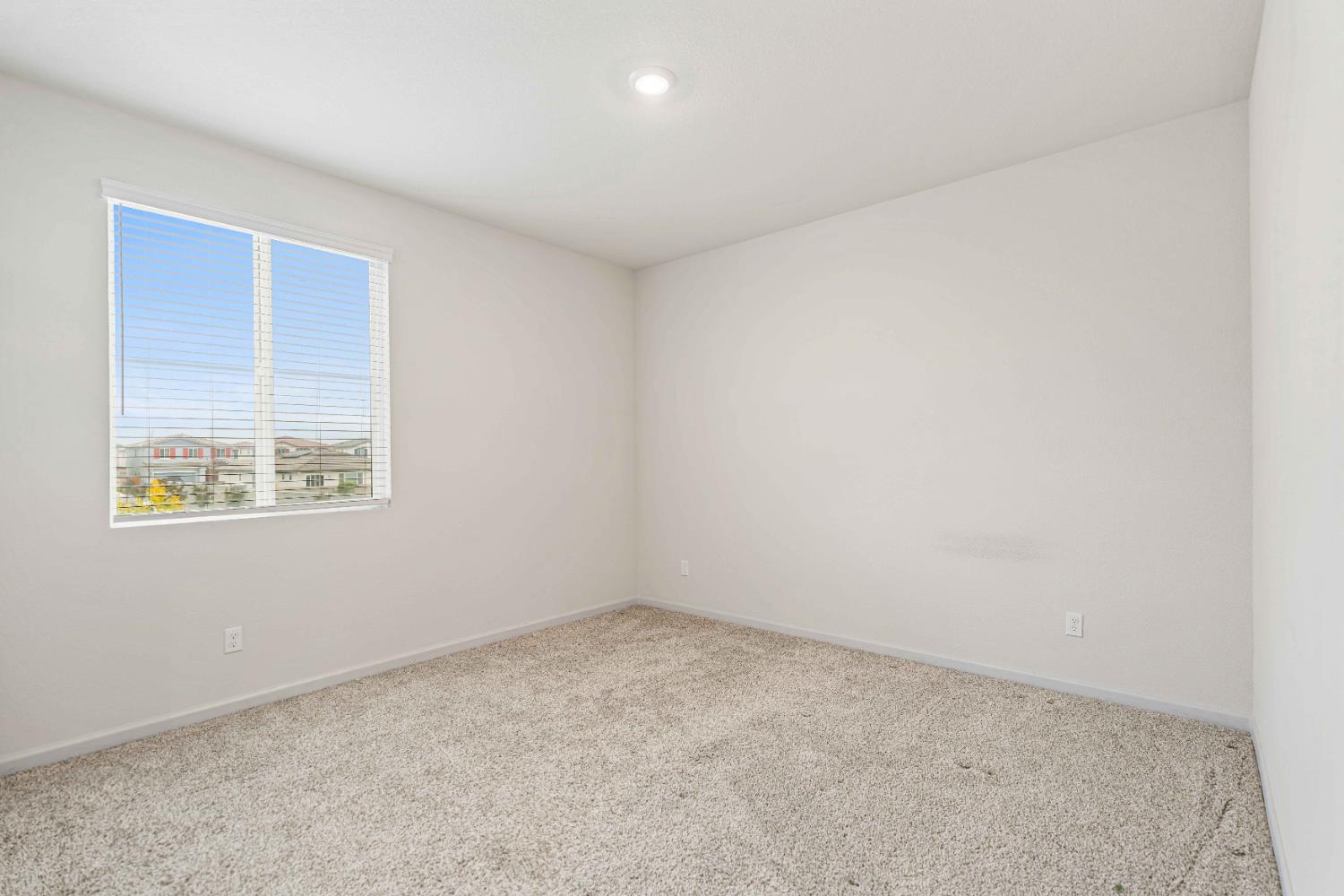 3095 Tower Street Manteca, CA 95337 - Photo 16 of 40 an empty room with windows