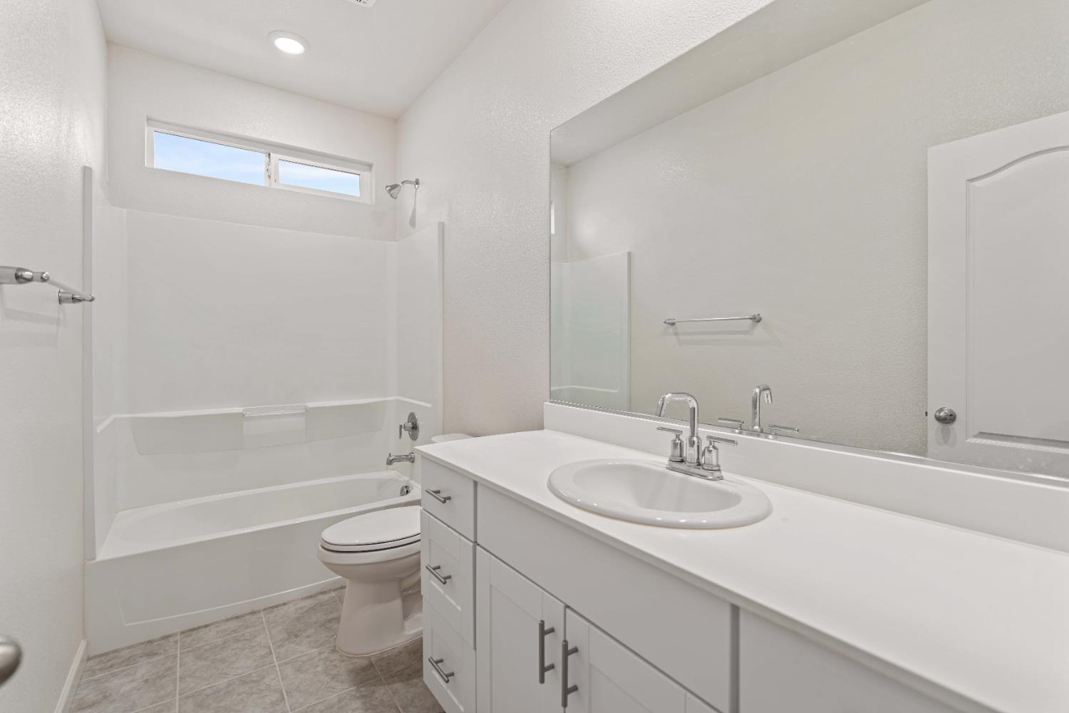 3095 Tower Street Manteca, CA 95337 - Photo 18 of 40 a bathroom with a sink toilet and shower