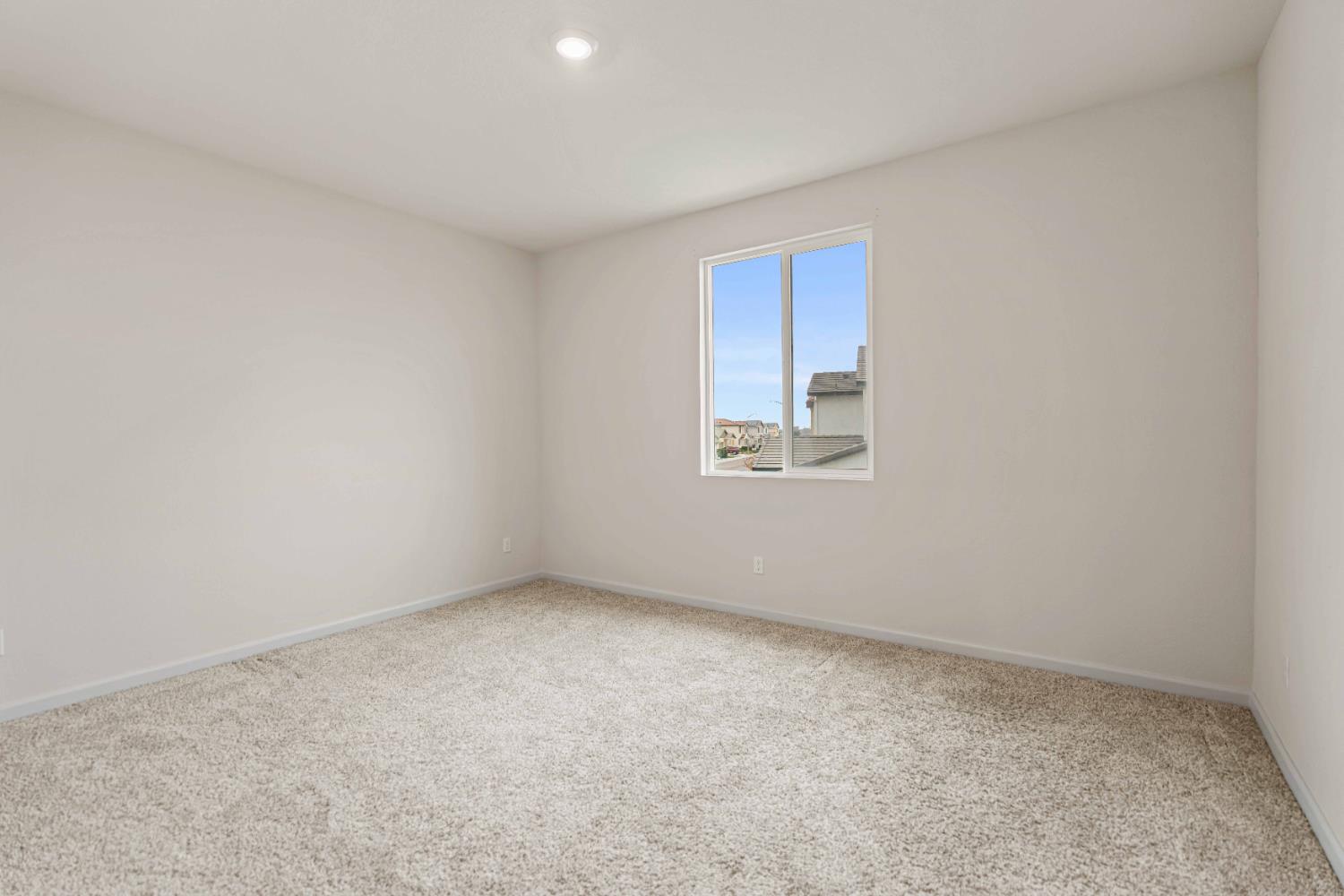 3095 Tower Street Manteca, CA 95337 - Photo 20 of 40 an empty room with a window