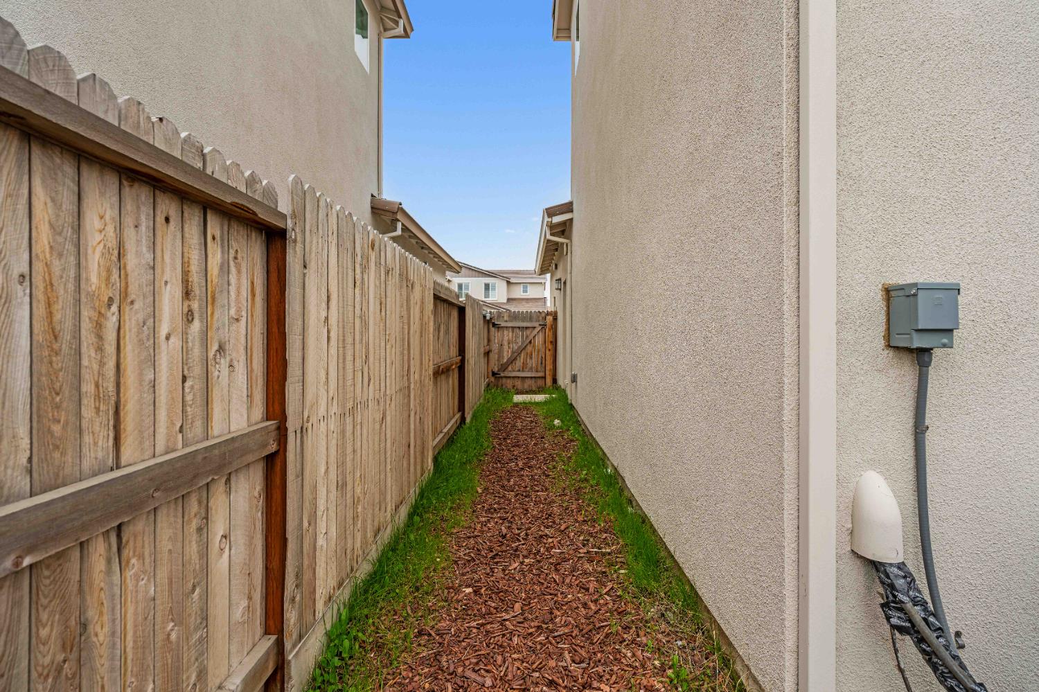3095 Tower Street Manteca, CA 95337 - Photo 32 of 40 a view of a pathway of a house with wooden floor