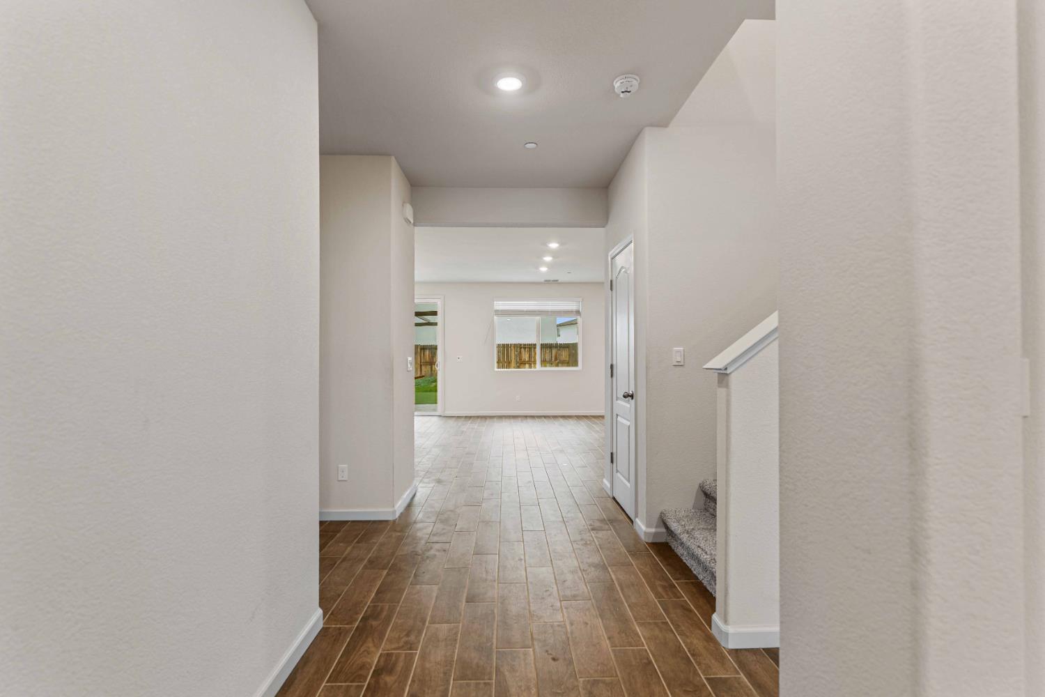 3095 Tower Street Manteca, CA 95337 - Photo 4 of 40 a view of a hallway with wooden floor