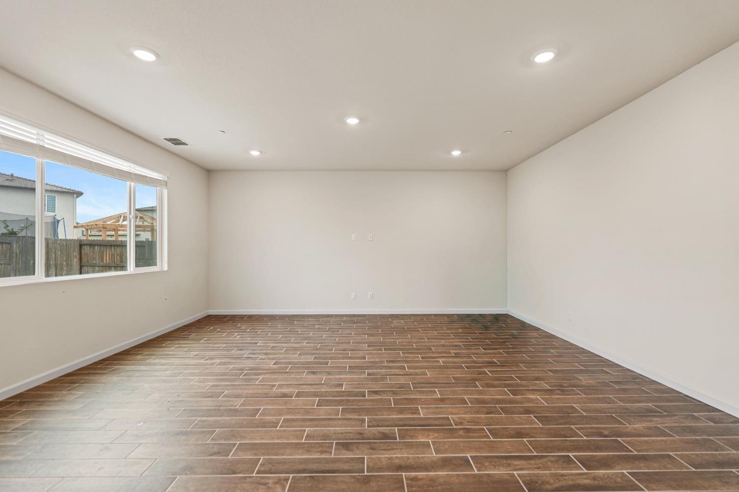 3095 Tower Street Manteca, CA 95337 - Photo 8 of 40 a view of an empty room with a window