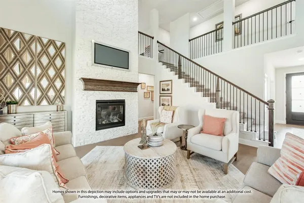 a living room with furniture a rug and a fireplace