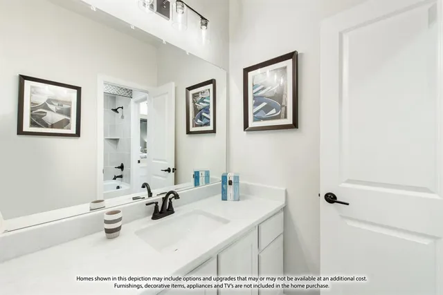 a bathroom with a sink a window and a mirror