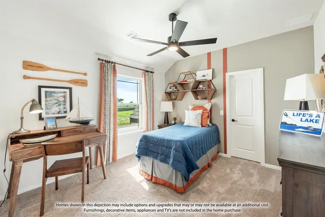 a bedroom with a bed and a table in it