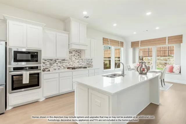 a kitchen with stainless steel appliances kitchen island granite countertop a sink and cabinets