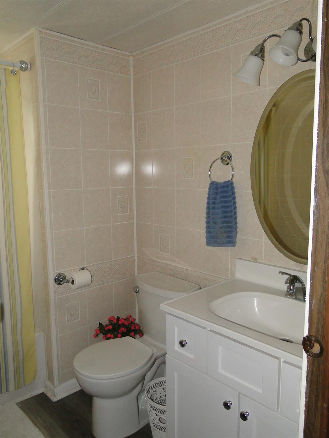 612 West 100 South Hebron, IN 46341 - Photo 12 of 18 a bathroom with a sink toilet and shower