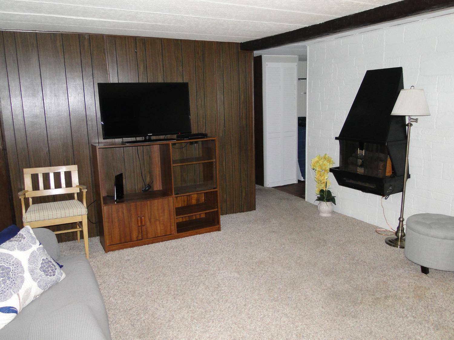 612 West 100 South Hebron, IN 46341 - Photo 3 of 18 a living room with furniture and a flat screen tv