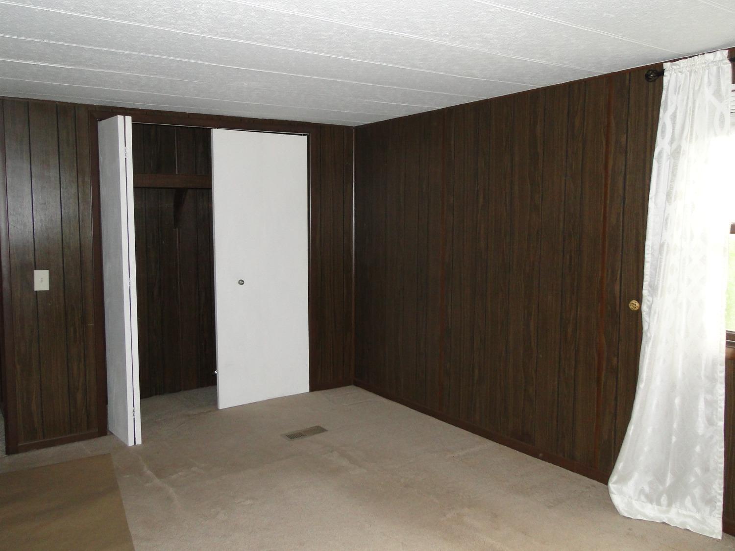 612 West 100 South Hebron, IN 46341 - Photo 10 of 18 a view of an empty room with wooden door