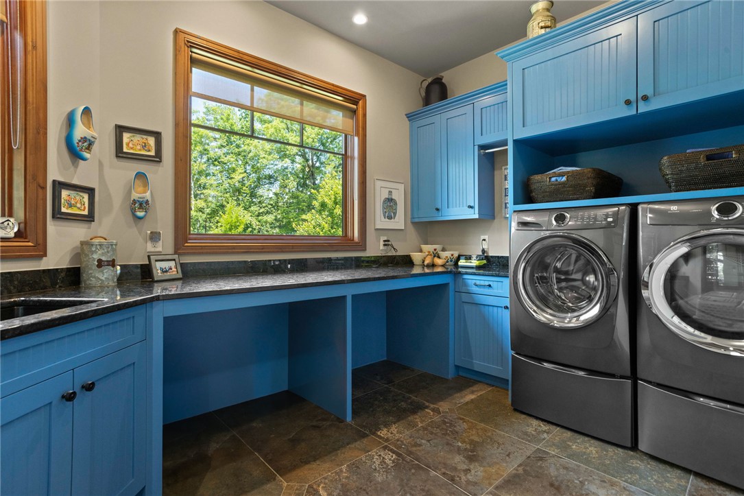 236 Palmer Way Sunset, SC 29685 - Photo 12 of 46 A vibrant laundry space features ample counter surface, integrated storage, and large windows.