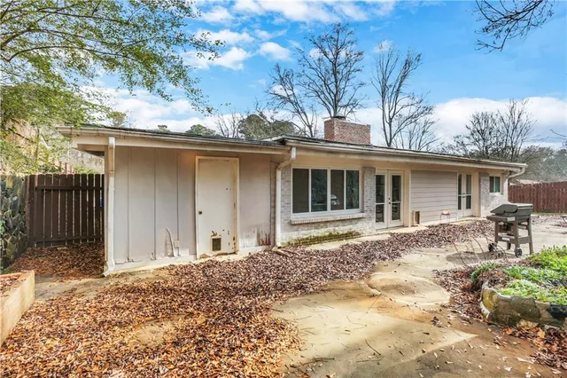 a backyard of a house with yard and seating space