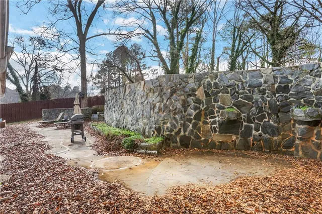 a bench is sitting in middle of the yard