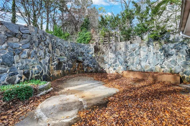 a view of a yard with large trees