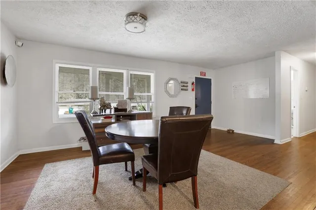 a view of a dining room with furniture and a table