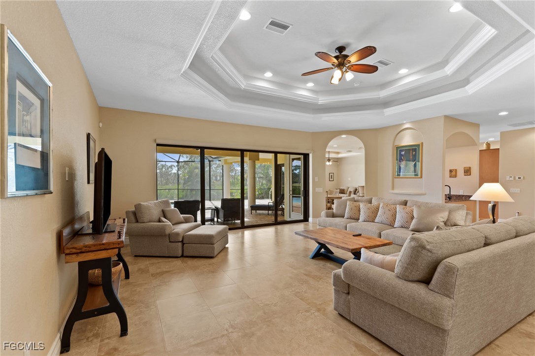 6057 Calusa Rdg Trail Bokeelia, FL 33922 - Photo 4 of 45 a living room with furniture and a flat screen tv