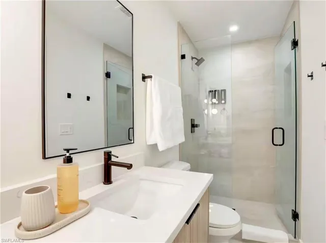 a bed room with a bed and a chair