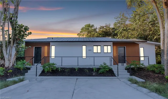 a kitchen with stainless steel appliances a sink and a refrigerator