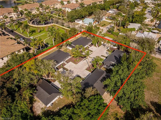 an aerial view of residential houses with outdoor space