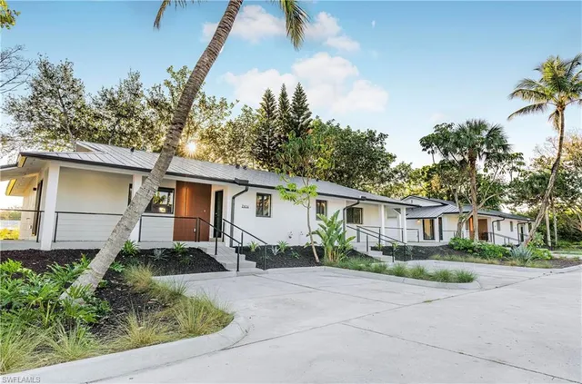 front view of a house with a yard