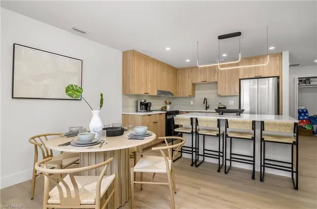 a bathroom with a sink toilet a mirror and shower