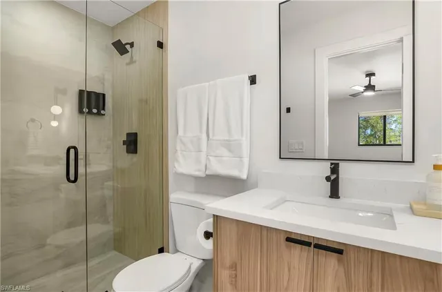 a bedroom with a bed and a lamp