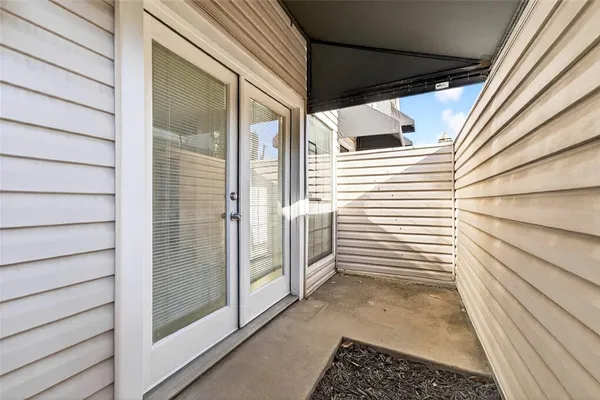 a view of a house with a door and wooden floor
