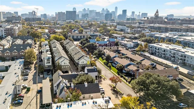 an aerial view of a city with lots of residential buildings