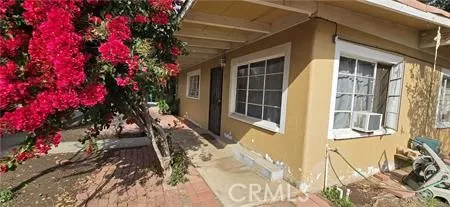 a view of a house with a tree