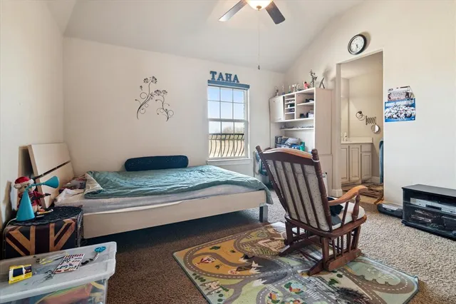 a bedroom with furniture and a window
