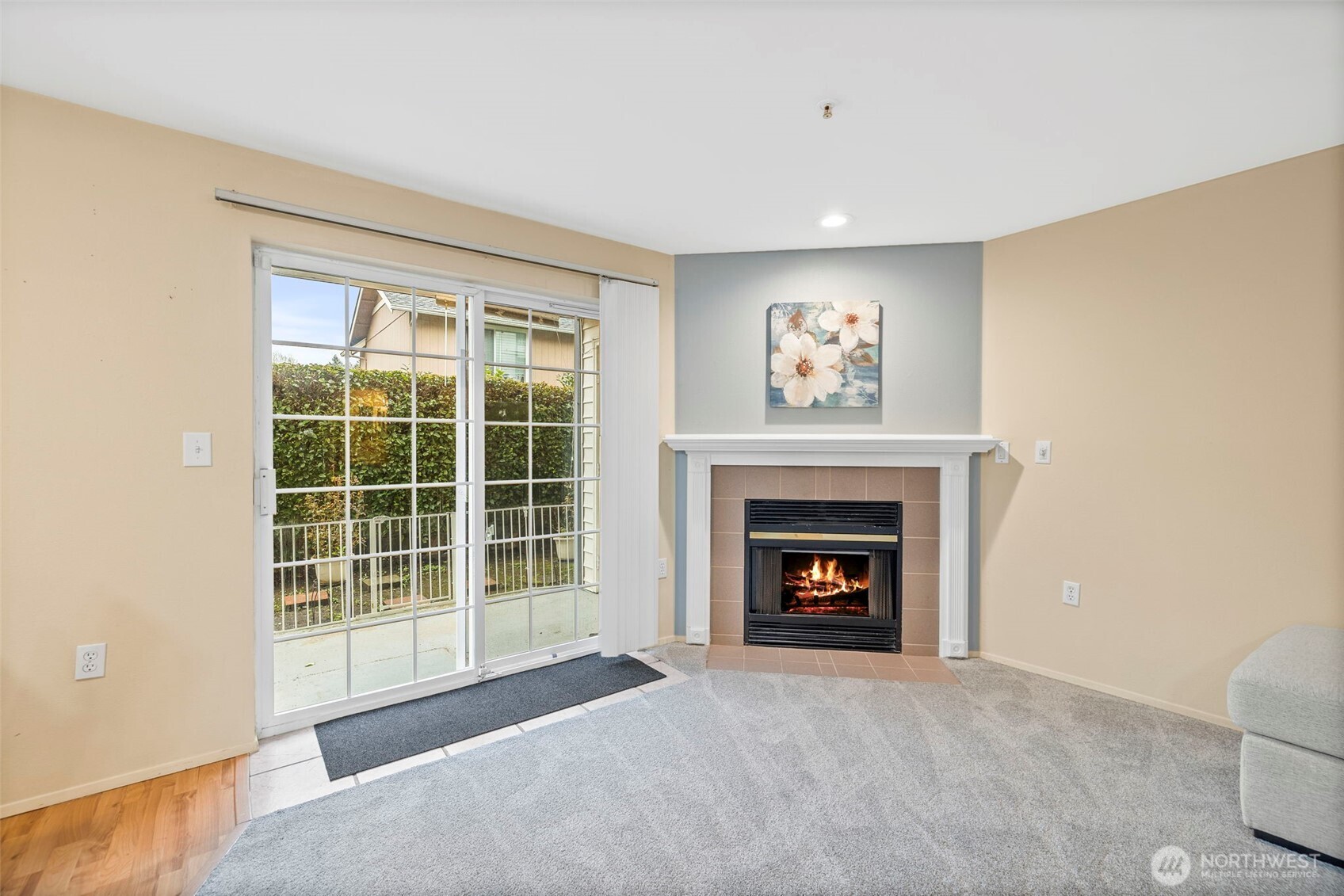 10824 Southeast 170th Street, Unit B103 Renton, WA 98055 - Photo 6 of 31 a living room with furniture and a fireplace