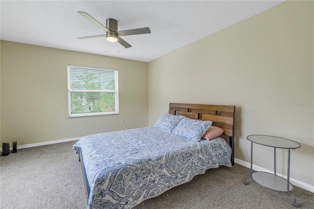1050 Starkey Road, Unit 2201 Largo, FL 33771 - Photo 19 of 68 a bedroom with a bed and a window