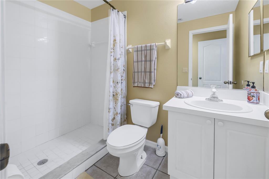 1050 Starkey Road, Unit 2201 Largo, FL 33771 - Photo 22 of 68 a bathroom with a sink toilet and shower