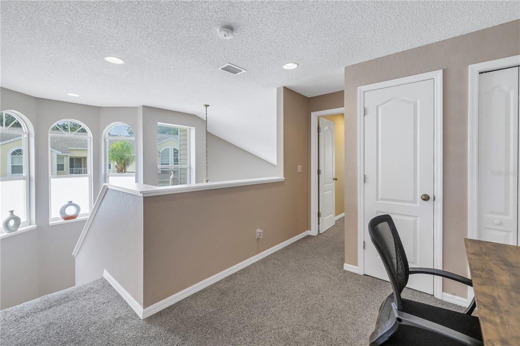 1050 Starkey Road, Unit 2201 Largo, FL 33771 - Photo 24 of 68 a view of workspace with wooden floor and windows