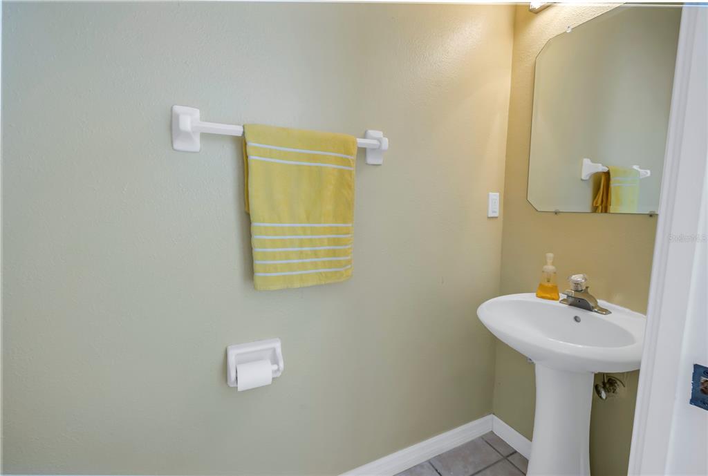 1050 Starkey Road, Unit 2201 Largo, FL 33771 - Photo 26 of 68 a bathroom with a sink and a mirror