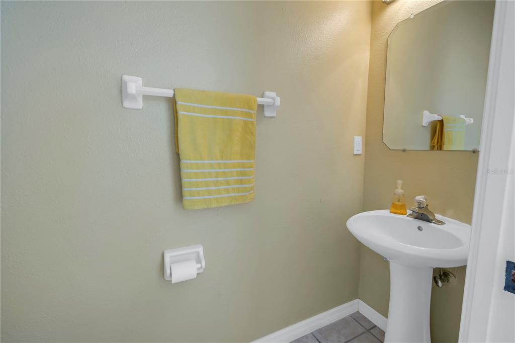 1050 Starkey Road, Unit 2201 Largo, FL 33771 - Photo 27 of 68 a bathroom with a sink and a mirror
