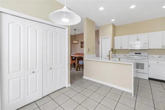 a view of a dining room with furniture wooden floor and a chandelier