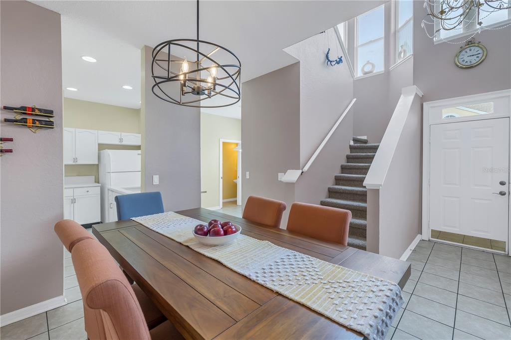 1050 Starkey Road, Unit 2201 Largo, FL 33771 - Photo 44 of 68 a view of a dining room with furniture and wooden floor