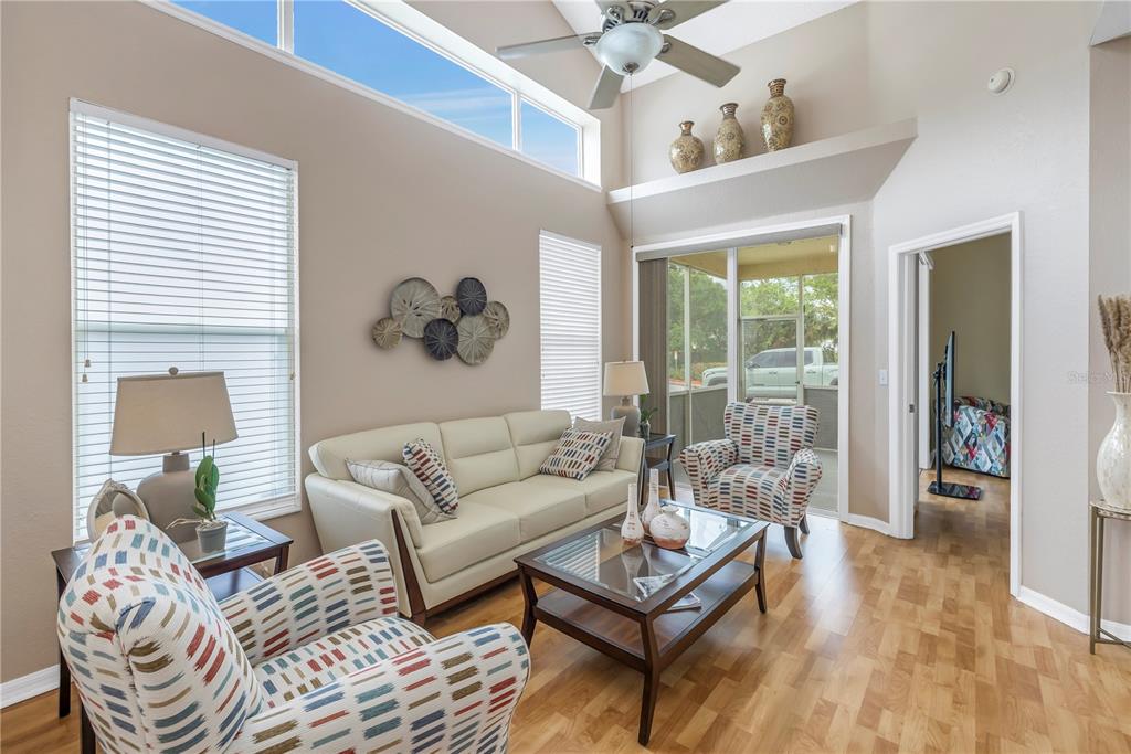 1050 Starkey Road, Unit 2201 Largo, FL 33771 - Photo 46 of 68 a living room with furniture and a large window