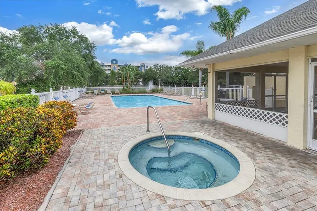 a view of a swimming pool with a patio