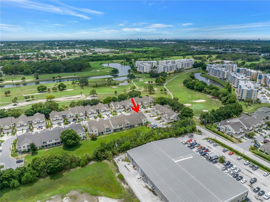 1050 Starkey Road, Unit 2201 Largo, FL 33771 - Photo 67 of 68 an aerial view of a city with lots of residential buildings ocean and mountain view in back