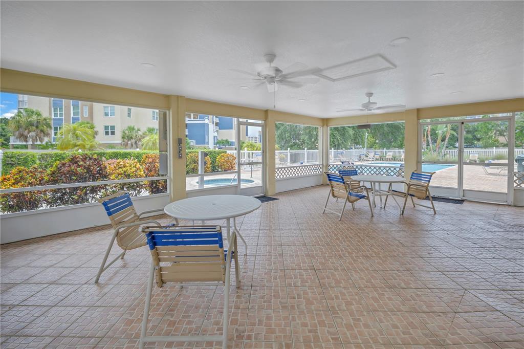 1050 Starkey Road, Unit 2201 Largo, FL 33771 - Photo 8 of 68 a living room with furniture and a large window
