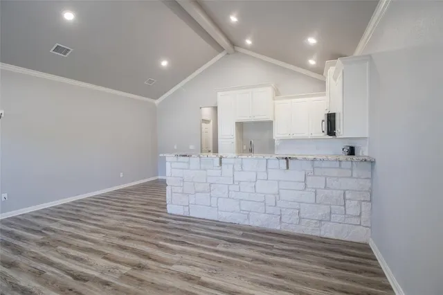 a living room with a wooden floor