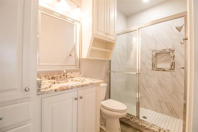 an empty room with a window and wooden floor