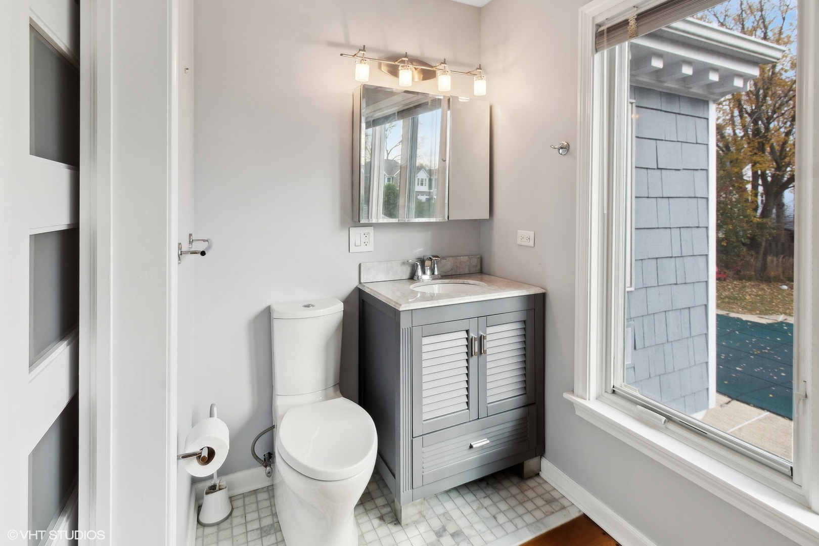 N543 Herrick Drive Wheaton, IL 60187 - Photo 20 of 37 a bathroom with a toilet sink and shower