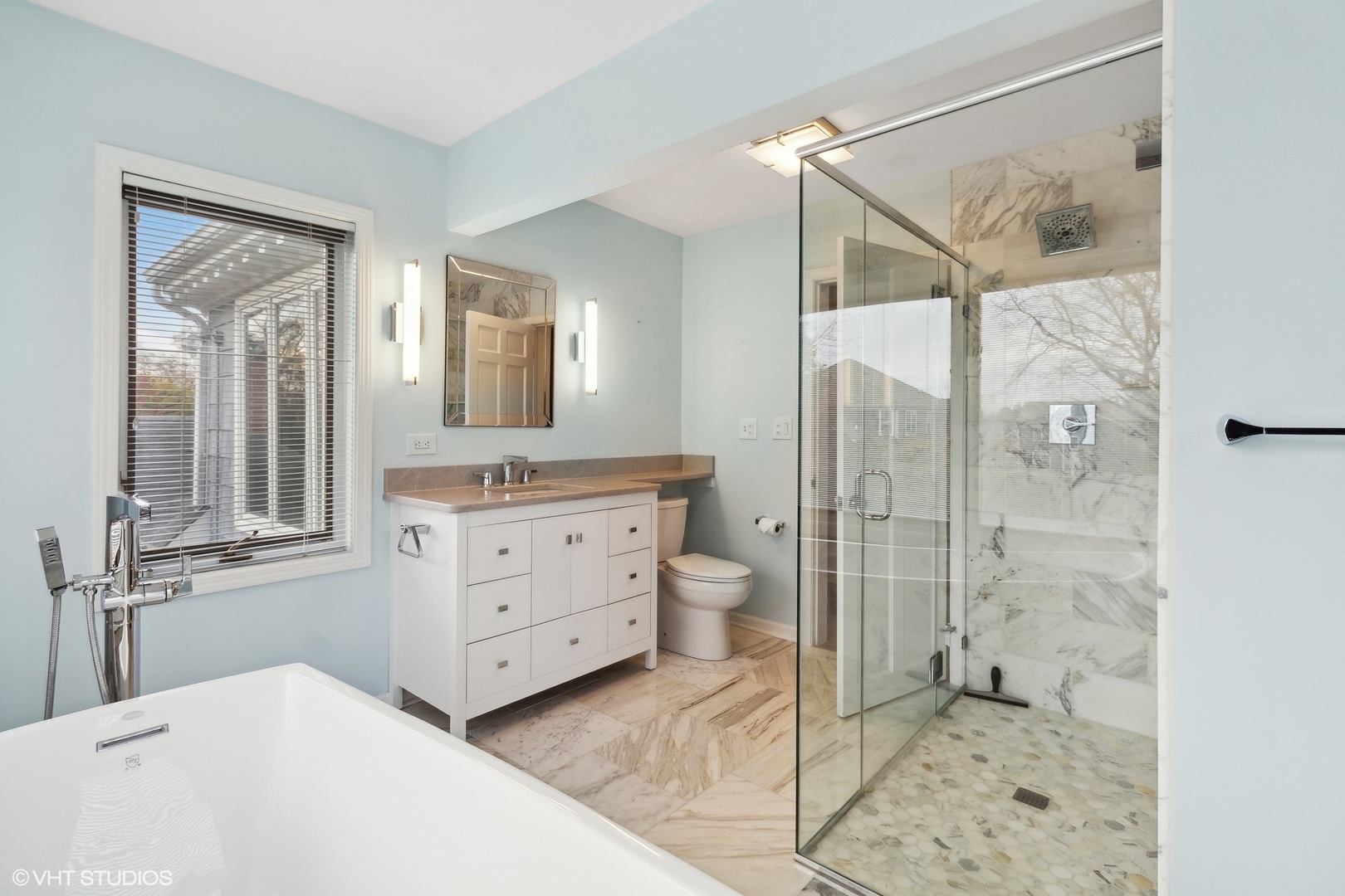 N543 Herrick Drive Wheaton, IL 60187 - Photo 24 of 37 a bathroom with a double vanity sink toilet mirror and shower