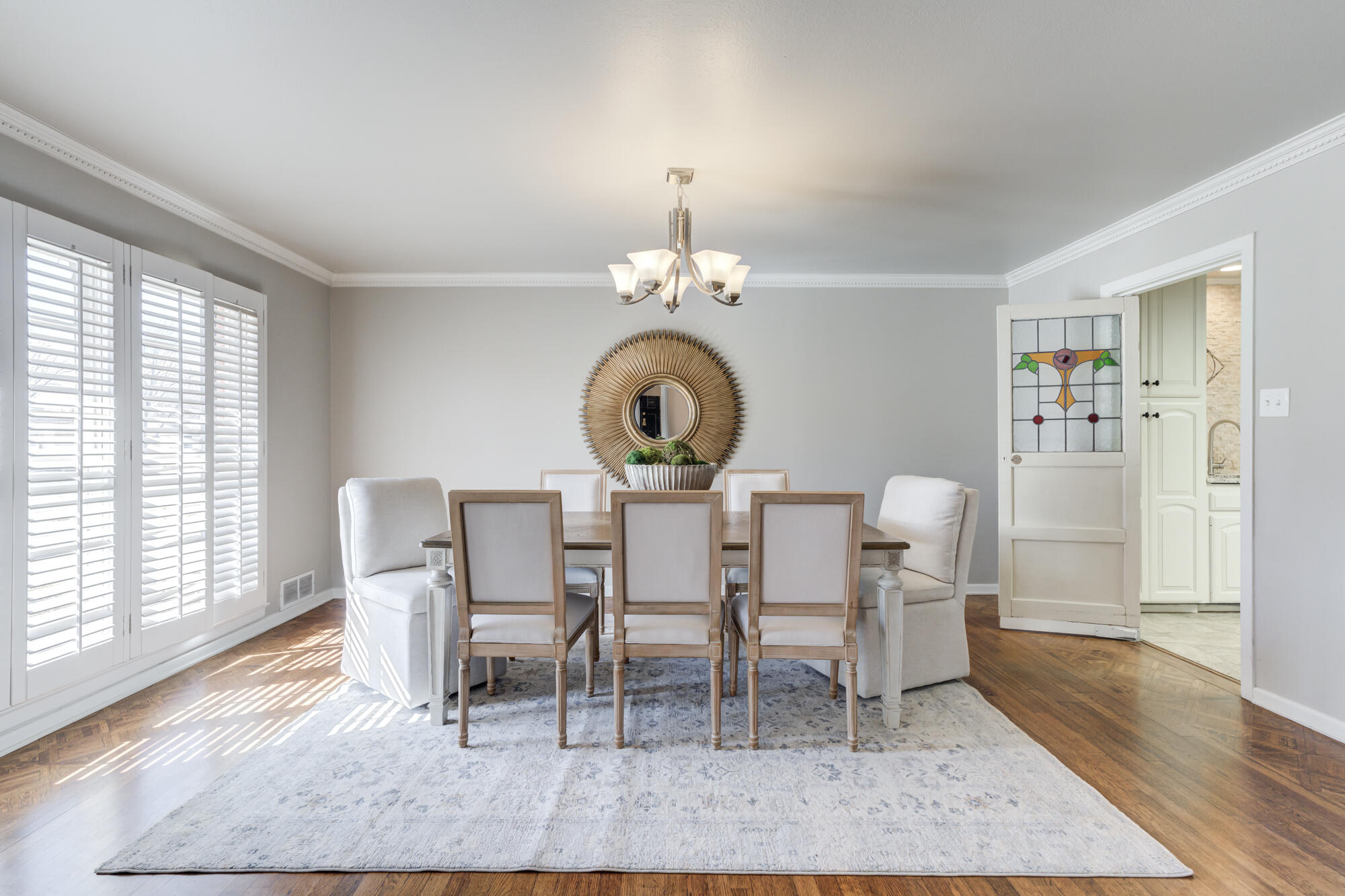 4608 18th Street Lubbock, TX 79416 - Photo 12 of 84 a view of a dining room with furniture and wooden floor