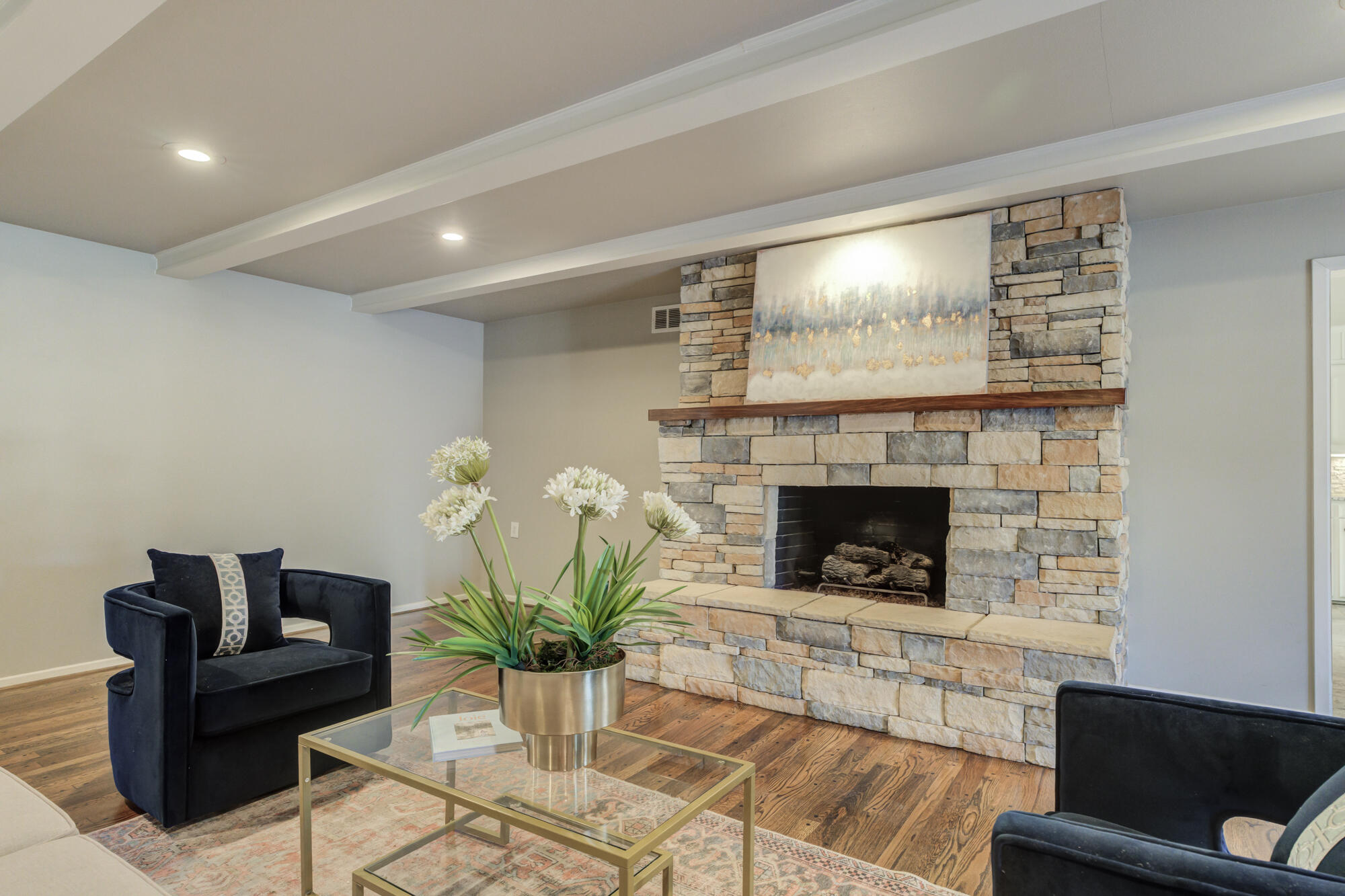 4608 18th Street Lubbock, TX 79416 - Photo 35 of 84 a living room with furniture and a fireplace