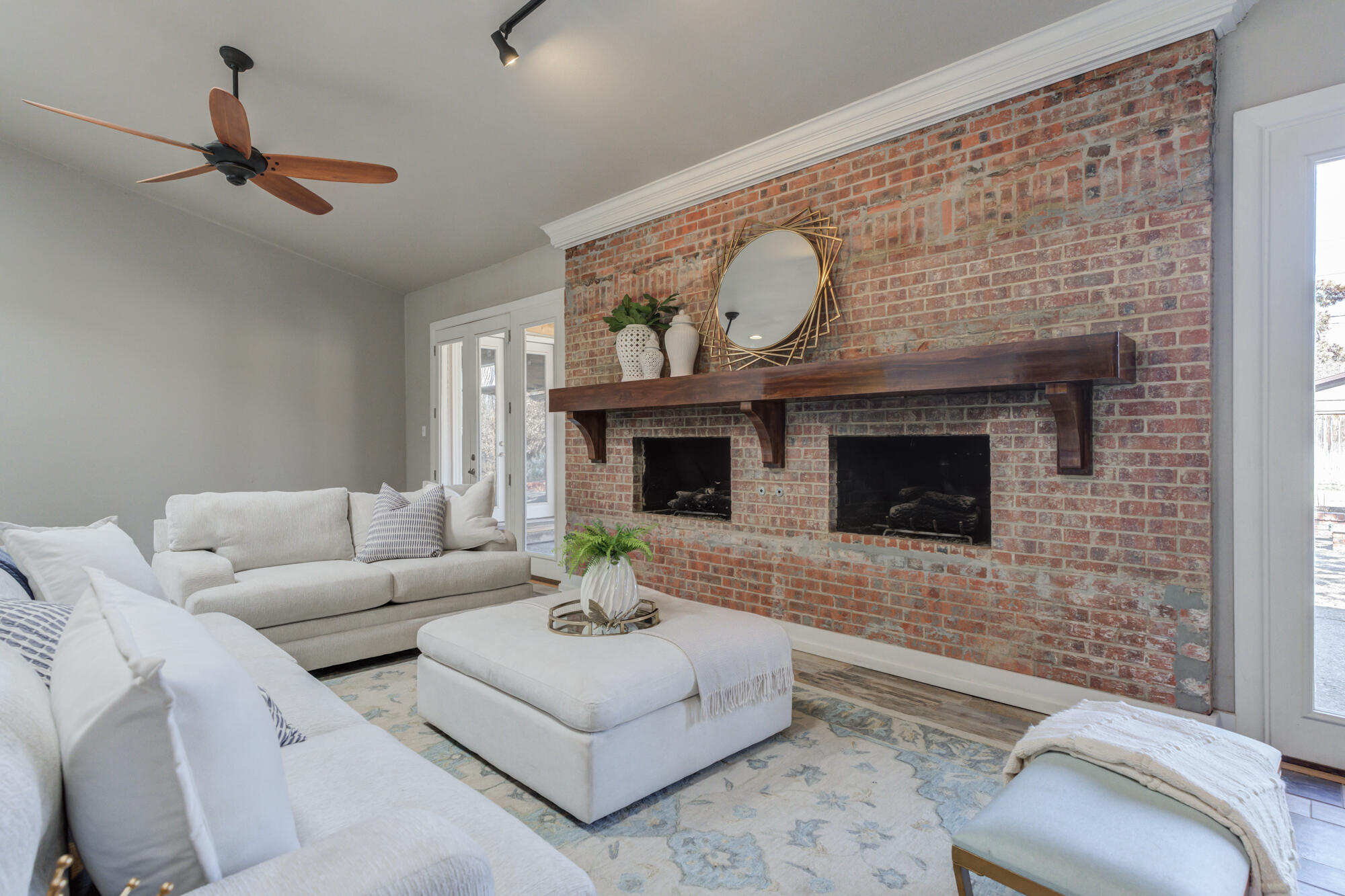 4608 18th Street Lubbock, TX 79416 - Photo 40 of 84 a living room with furniture and a fireplace