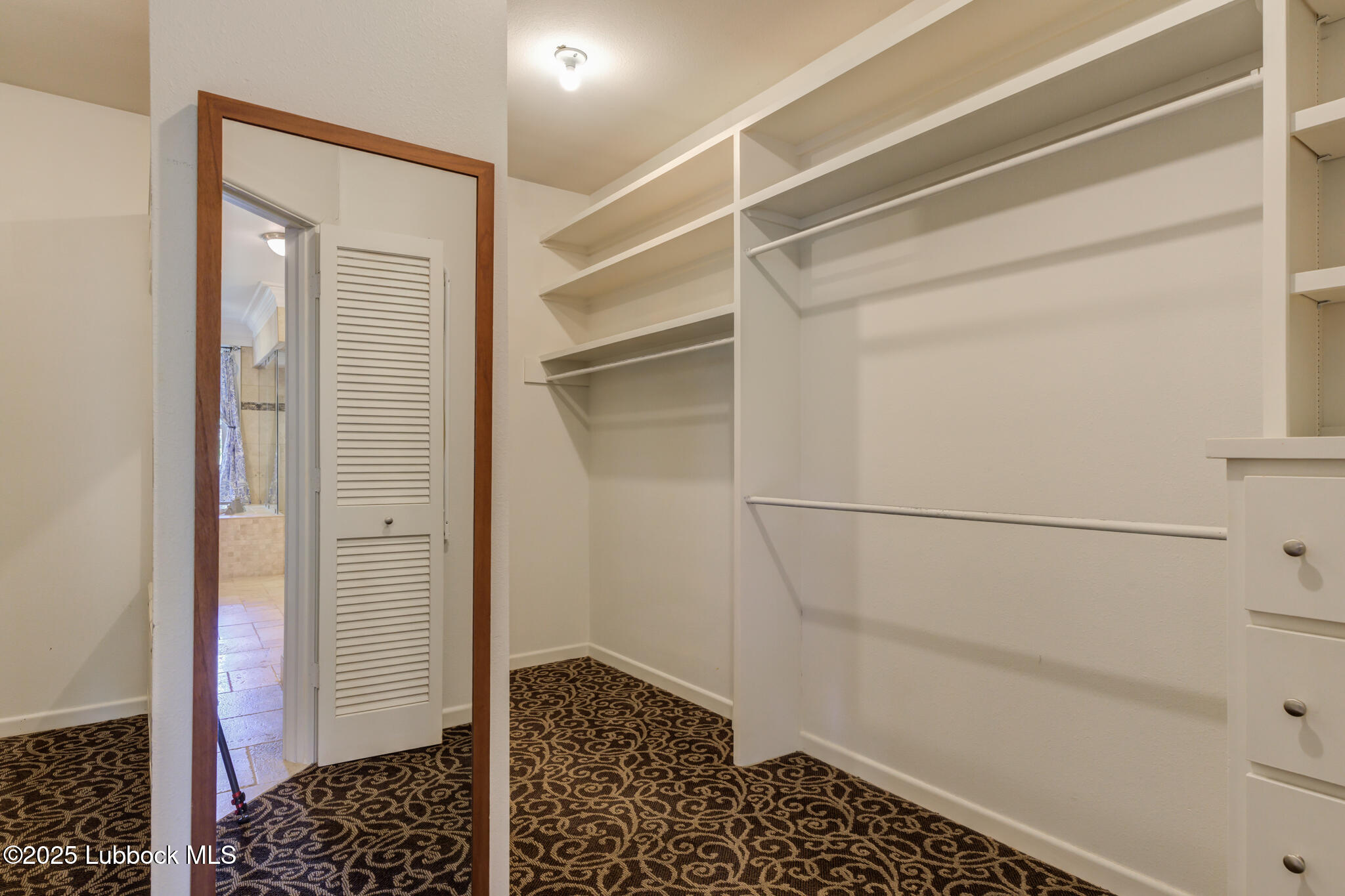 4608 18th Street Lubbock, TX 79416 - Photo 60 of 84 a bathroom with a shower